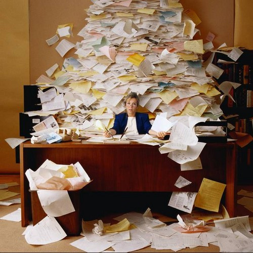 Woman surrounded by clutter